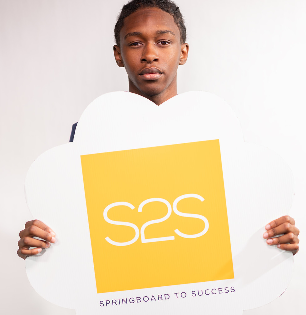 Young man holding an S2S Springboard to Success sign.