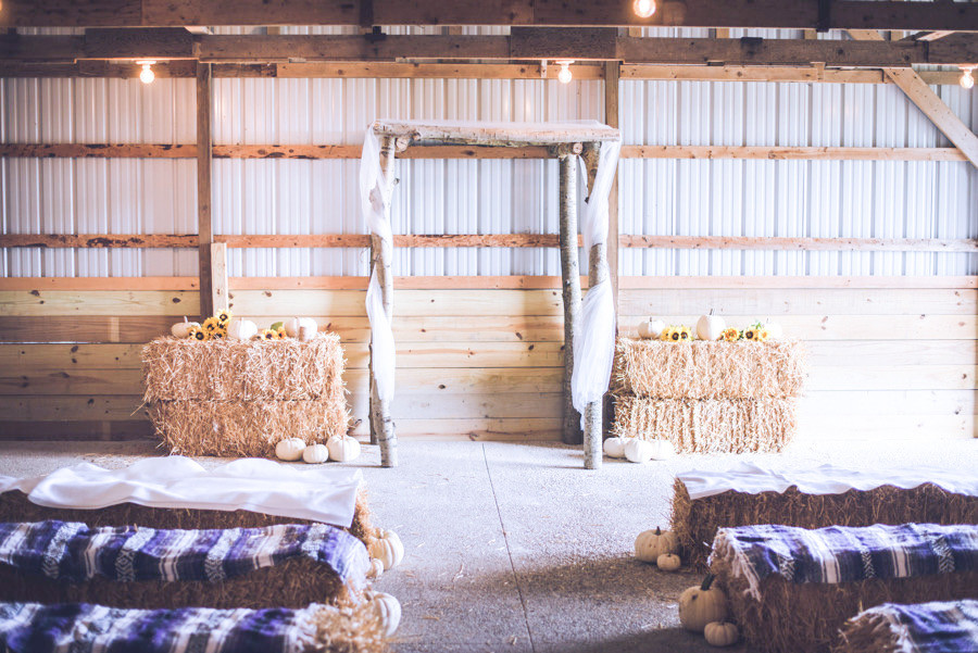 Rustic barn wedding ceremony setup