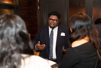 S2S Alumni networking at a formal event