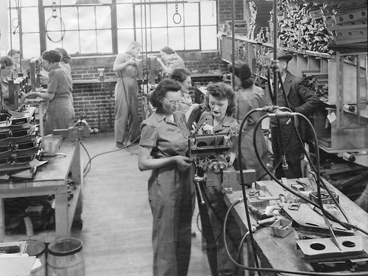 Women workers assembling products in a factory