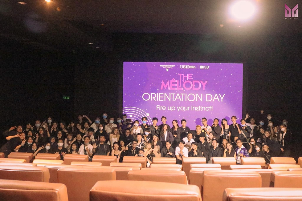 A vibrant group photo from the MV Contest's successful Orientation Day shows participants in front of a colorful display reading "The Melody Orientation Day: Fire up your Instinct!"