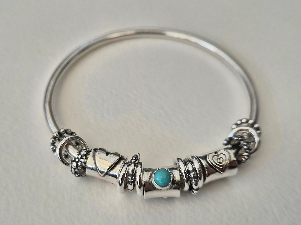Thumbnail: A Lovely Chunky Bangle with lots of Detailed Silver Rings and a Turquoise. 