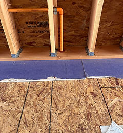Emory Heights firestopping at a CPVC sprinkler pipe penetration in wood-frame construction