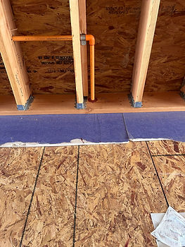 Emory Heights firestopping at a CPVC sprinkler pipe penetration in wood-frame construction.