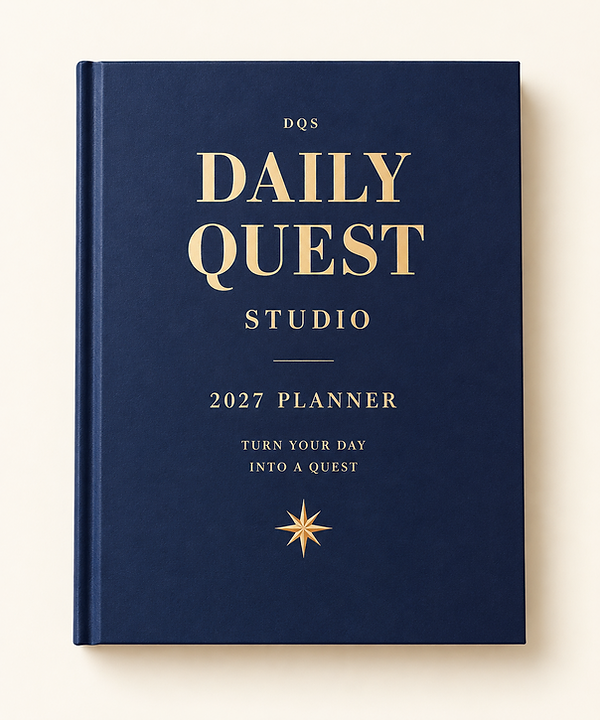 Printed 2027 Daily Quest Studio Flagship Planner with navy hardcover and gold cover details