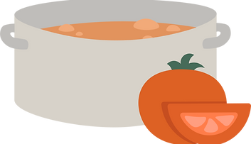 A grey soup pot with tomato soup and a raw whole tomato and one tomato slice sitting in front of the pot