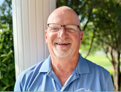 Constable Robert Mitchell poses with a big smile for a headshot. Photo Credit: Cape Henlopen School District