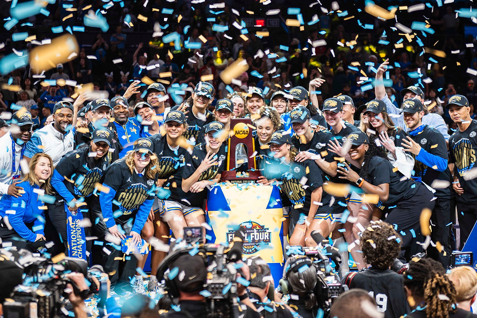 UCLA celebrates their victory as NCAA National Women's Basketball Champions amidst a flurry of confetti and excitement.