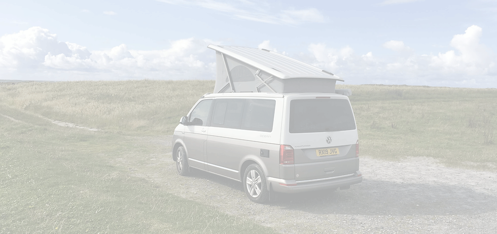 Silver VW California Van with Roof Up in Countryside