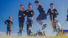 Babheke SPS in the Eastern Cape, South Africa, new Amalooloo toilets in the background with kids skipping