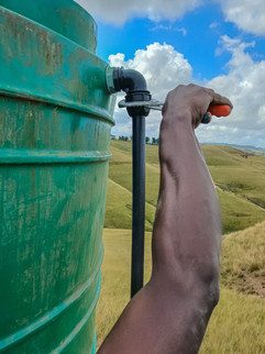 Babheke SPS, Lusikisiki, Eastern Cape, South Africa - Installing water tank on top of kitchen container