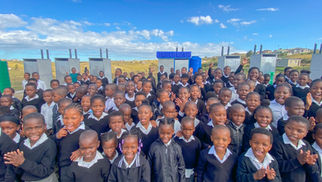 Babheke SPS in the Eastern Cape, South Africa, new Amalooloo toilets with children celebrating