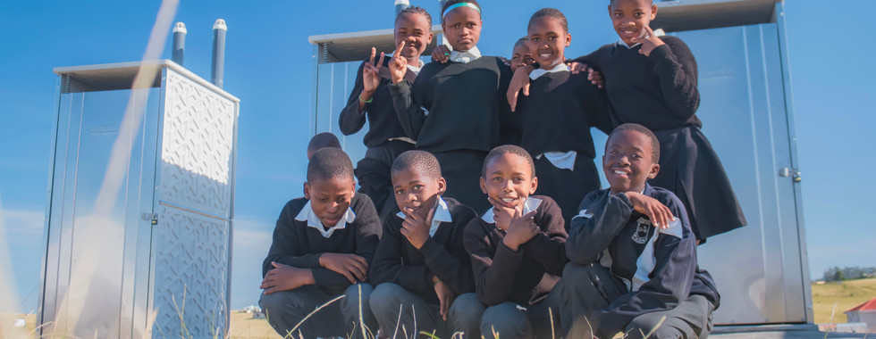 Babheke SPS in the Eastern Cape, South Africa, kids posing in front of their new toilets