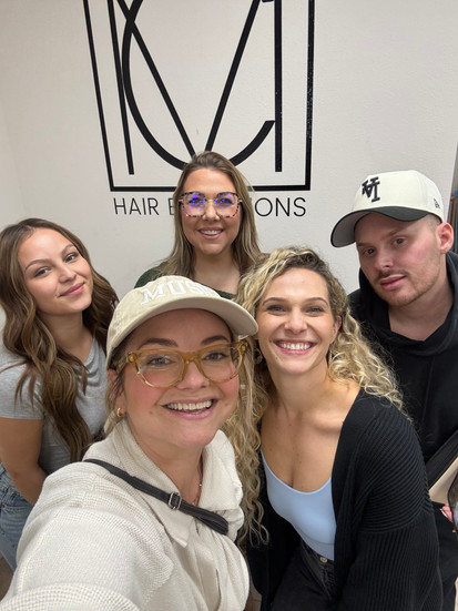 group photo with hair stylists from muse salon