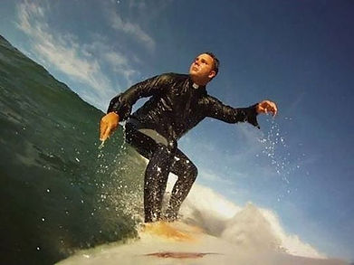 Fr.Calloway_surfing.jpeg