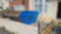 Skip in front garden