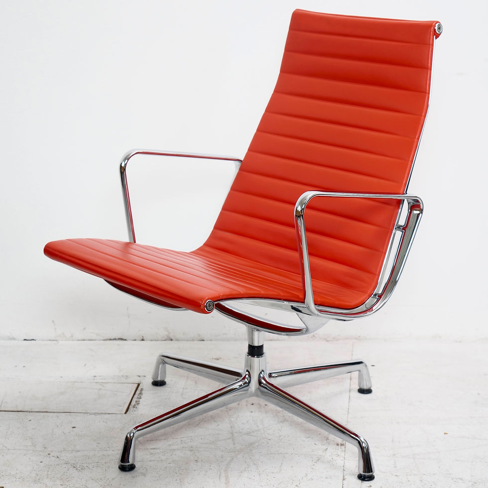 Miniaturbild: Eames Aluminium Group EA116 red leather lounge chair.