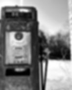 An old gas pump in black and white