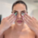 Nina Unrated displaying colorful, patterned nail art portfolio