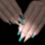 Nina Unrated's Long coffin nails with green marble tips and gold shells.