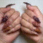 Nina Unrated's Stiletto nails with 3D floral art in autumn tones