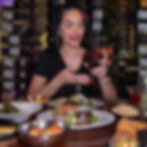 Nina Unrated recording mobile content creation at a dinner table