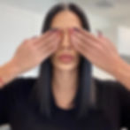 Nina Unrated with black hair covering her eyes with manicured hands