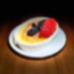Crème brûlée with fresh berries for mobile content creation