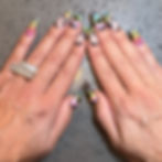 Nina Unrated's Long stiletto nails with colorful butterfly and heart art