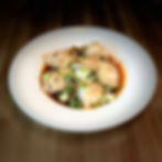 Steamed dumplings with chili oil and scallions