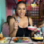 Nina Unrated holding a bunny character toy at a themed cafe