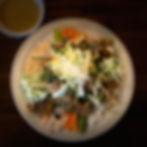 Overhead view of a vibrant Asian noodle dish.