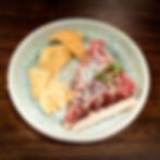 Tuna tartare with sesame seeds and crisps on a plate