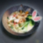 Bowl of ramen with mussels, bok choy, and narutomaki