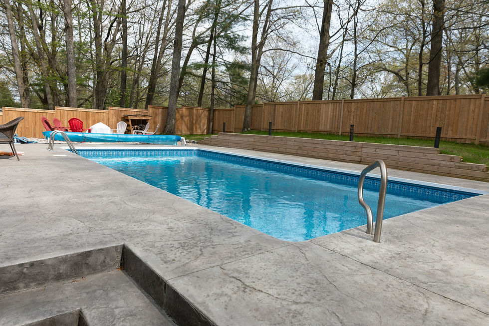 Modern rectangular backyard pool with concrete deck, representing professional pool services near me in Cape Cod and Martha’s Vineyard