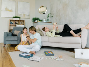  A cozy family living room with everyday clutter waiting to be cleaned.