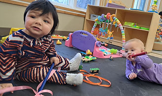 two children playing on the floor