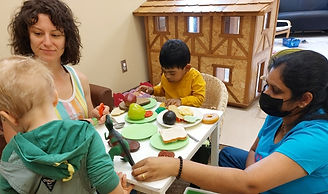 children and adults eating