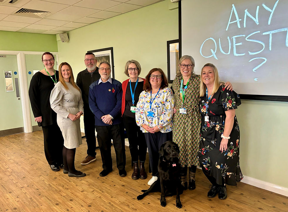 The group from the supporting veterans to access cancer information project are stood proudly together looking directly at the camera.