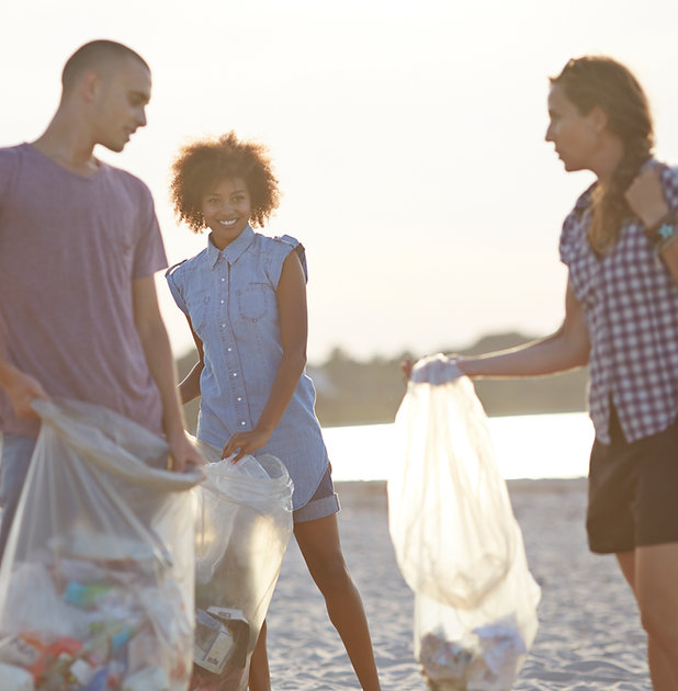 Volunteers Collecting Trash on Beach