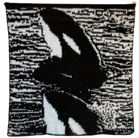 Detailed close-up of the black-and-white Orca design on the front side of the double-knit wall hanging.