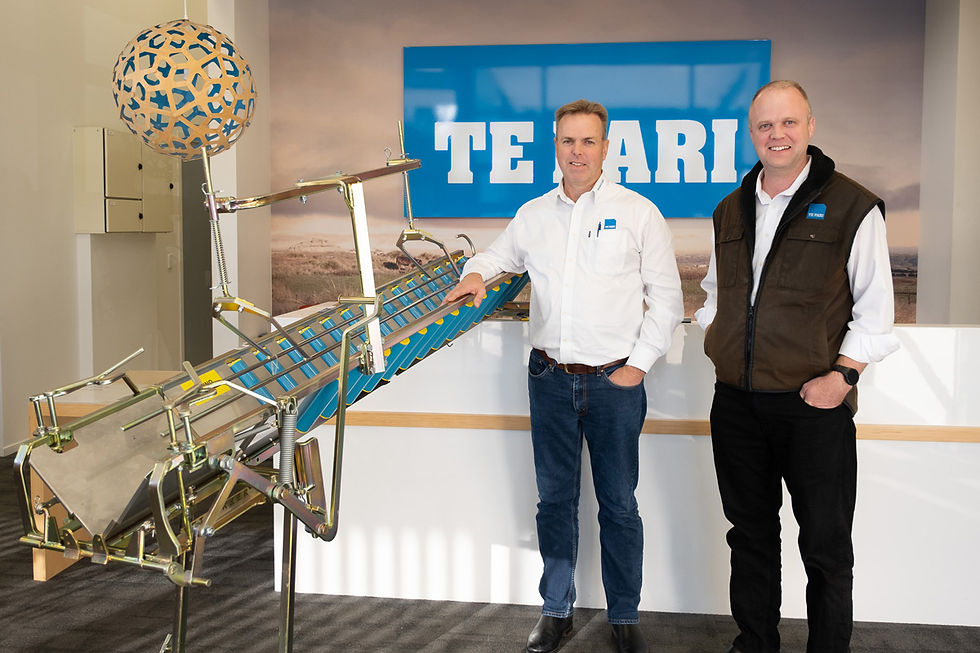 L to R: Te Pari global sales manager Jeremy Blampied and Te Pari CEO Patrick Blampied stand beside the Vetmarker model