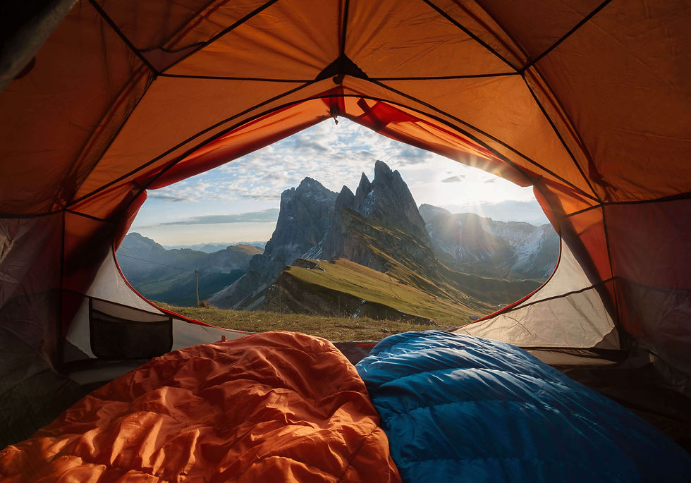 Tent camping view of mountains at sunrise