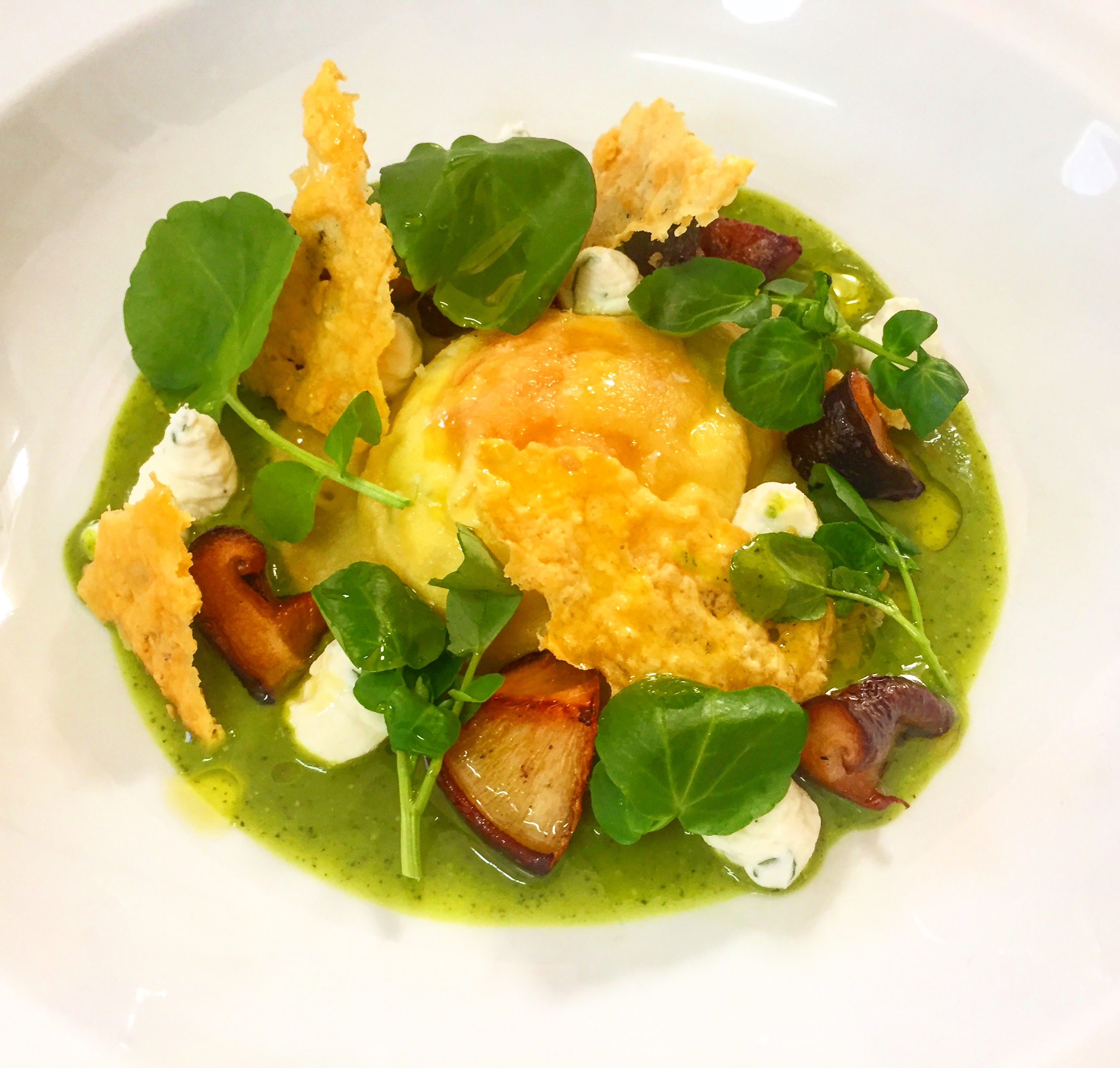Egg yolk ravioli, watercress veloute