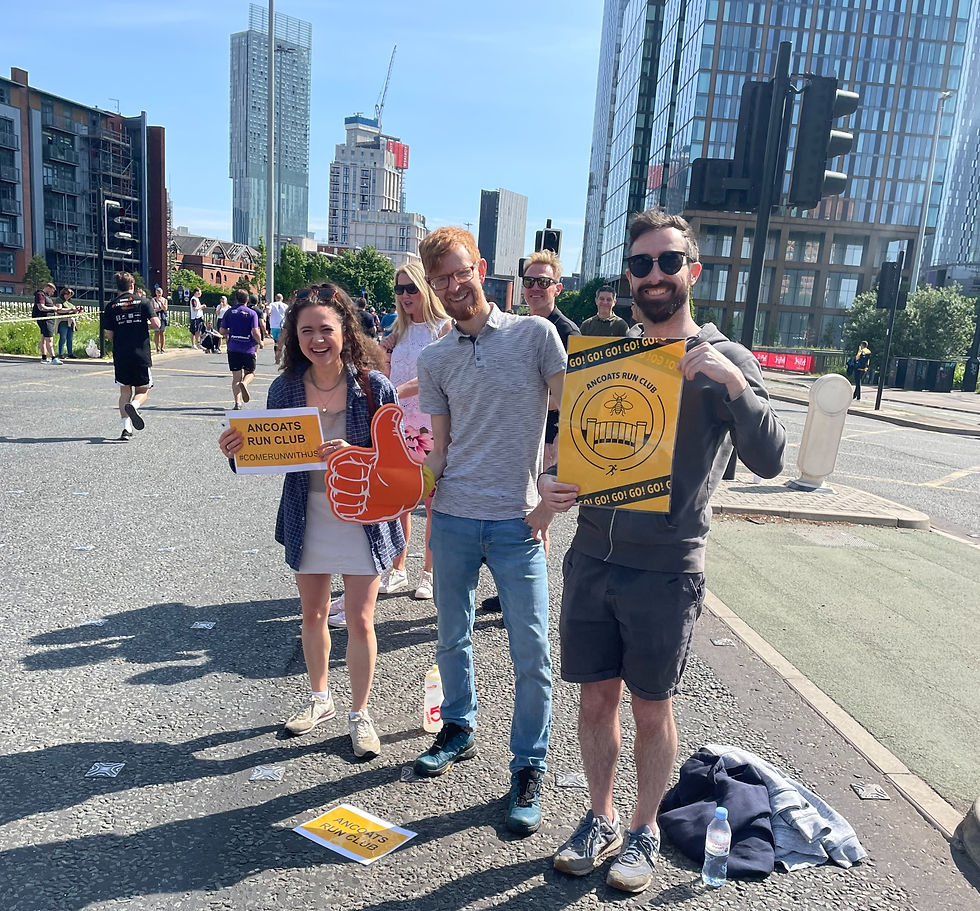 three run supporters for the Manchester half marathon holding ARC signs