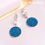 Μικρογραφία: Ατσάλινα Σκουλαρίκια Κοντά 3cm με Στρογγυλό Στοιχείο με Γαλάζιες Πέτρες 3610