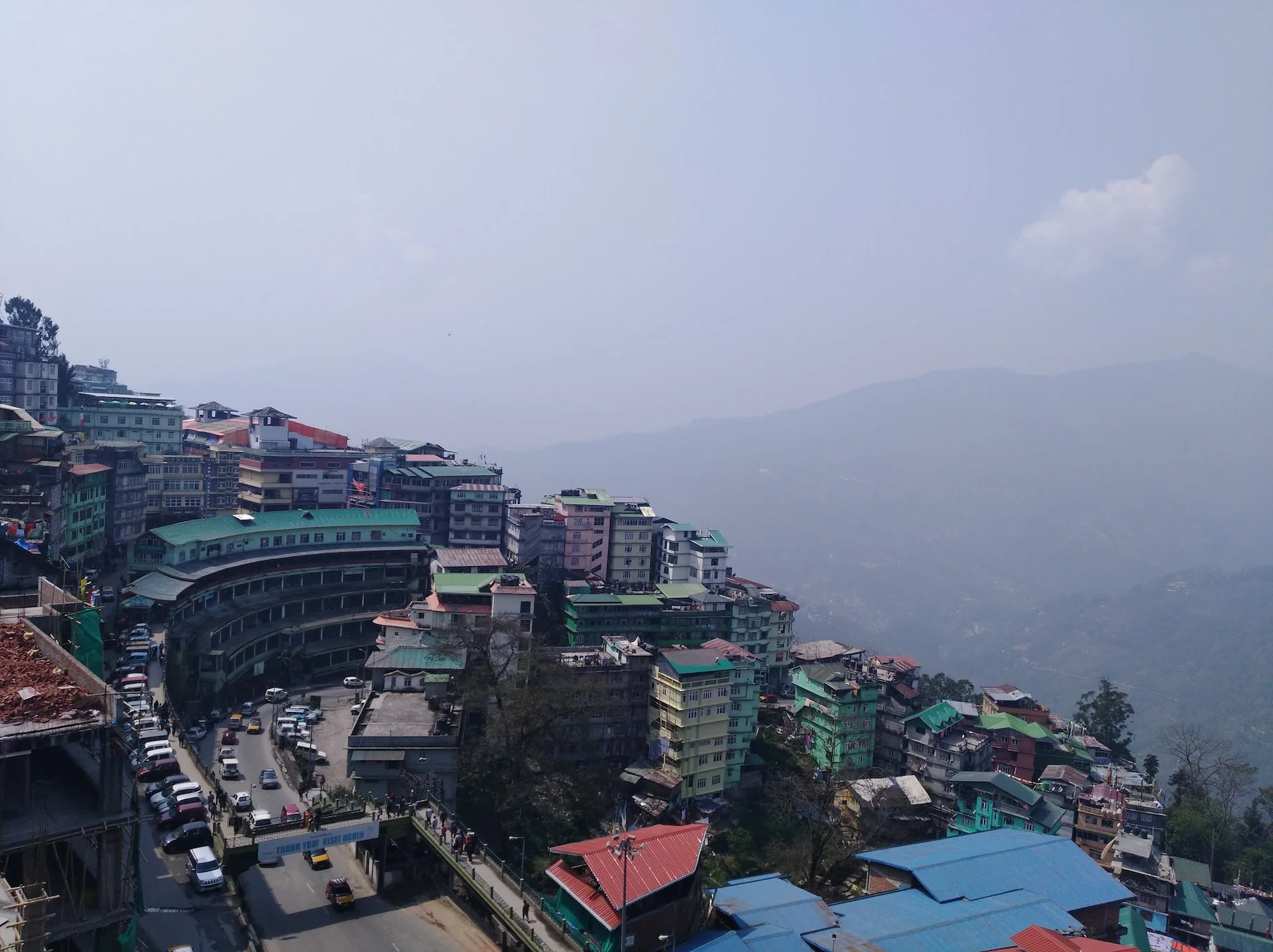 Aerial view of buildings and road in city located in gangtok