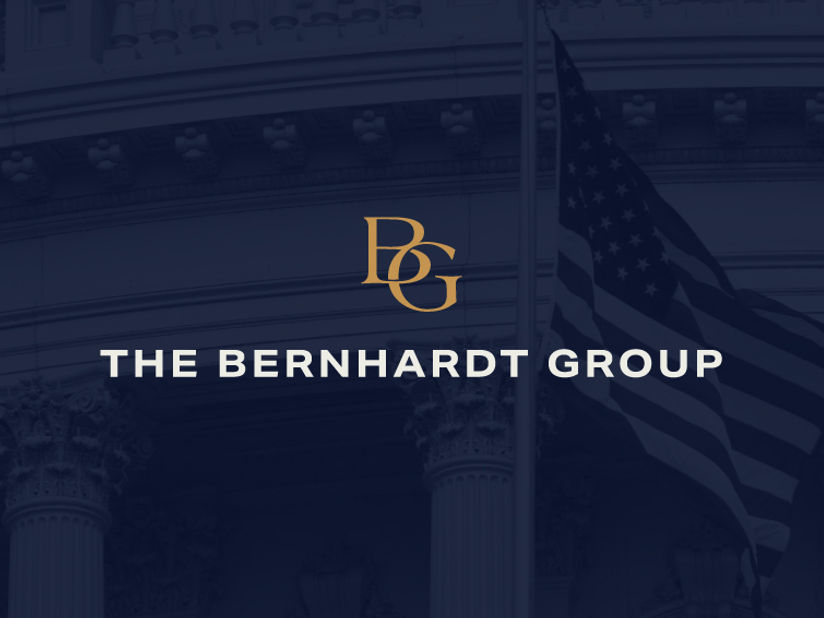 The Bernhardt Group logo on top of a screened back image of a USA flag and a building in Washington DC