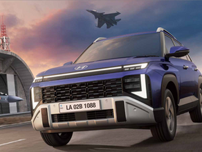 Blue SUV Hyundai Venue 2025 facelift drives on runway with fighter jets overhead and hangar in background.