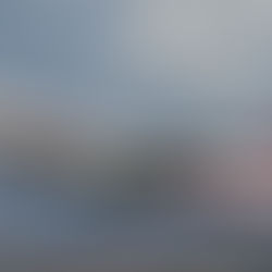 Airplane taking off, marked with "Malaysia Airlines," against a cloudy sky. "Hollywood" sign visible on hills in the background.